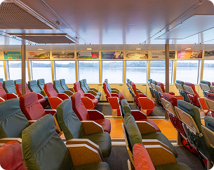 Spacious inner main passenger deck seating layout rows looking toward windows